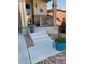 Inviting front porch with stone accents, colorful flower pots, and a decorative blue star above the door at 3173 Youngheart Way, Castle Rock, CO 80109