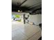 Spacious garage featuring a boat on a trailer parked inside and some storage shelves on the back wall at 3173 Youngheart Way, Castle Rock, CO 80109