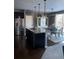 Kitchen featuring an island and stainless steel appliances with open access to dining area at 3173 Youngheart Way, Castle Rock, CO 80109
