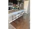 Modern kitchen island with granite countertops and bar stool seating, ideal for casual dining at 3173 Youngheart Way, Castle Rock, CO 80109