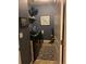 The functional laundry room features a front-load washer/dryer and patterned rug at 3173 Youngheart Way, Castle Rock, CO 80109