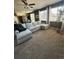 Spacious living room with a comfortable sectional sofa, neutral tones, and lots of natural light at 3173 Youngheart Way, Castle Rock, CO 80109