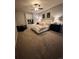 Well-lit main bedroom featuring a comfortable bed, soft carpet, and warm, inviting decor at 3173 Youngheart Way, Castle Rock, CO 80109