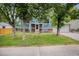 Charming two-story home featuring an attractive blue exterior and a well-maintained front lawn at 4678 S Lewiston Way, Aurora, CO 80015