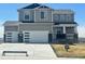 Charming two-story home with a three car garage and landscaped front yard at 42992 Colonial Trl, Elizabeth, CO 80107
