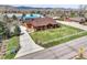 Beautiful aerial view of a home with a lush green lawn and charming curb appeal at 5365 Eldridge St, Arvada, CO 80002