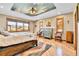 Charming bedroom with beautiful hardwood floors, a cloud-themed ceiling, and two large windows at 5365 Eldridge St, Arvada, CO 80002