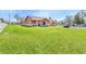 Expansive lawn showcases this ranch-style home with a rustic design and spacious outdoor area at 5365 Eldridge St, Arvada, CO 80002