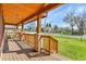 Covered front porch showcasing stone pillars and a stained wood ceiling at 5365 Eldridge St, Arvada, CO 80002