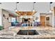 Large kitchen island with double sink, marble countertops, and pendant lights at 5365 Eldridge St, Arvada, CO 80002