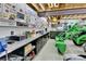 Organized workshop area featuring built-in storage, workbenches, and a variety of tools at 5365 Eldridge St, Arvada, CO 80002
