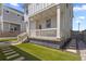 Inviting backyard featuring manicured turf, and a covered porch at 175 Westerly Blvd, Erie, CO 80516