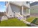 Charming backyard featuring manicured turf, and a covered porch at 175 Westerly Blvd, Erie, CO 80516