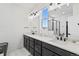 Bright bathroom featuring double vanity with marble countertops and modern fixtures at 175 Westerly Blvd, Erie, CO 80516
