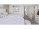Cozy bedroom with neutral decor, plush bedding, and stylish wall art at 175 Westerly Blvd, Erie, CO 80516