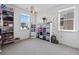 Versatile bedroom with natural light, accent butterflies, and closet space at 175 Westerly Blvd, Erie, CO 80516
