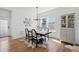 Elegant dining room with modern chandelier, decorative rug, and ample natural light at 175 Westerly Blvd, Erie, CO 80516