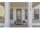 Inviting front porch with decorative touches and a welcoming green door at 175 Westerly Blvd, Erie, CO 80516