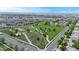Wide aerial perspective of a neighborhood with green spaces, walking paths and residential homes at 19730 E 58Th Pl, Aurora, CO 80019