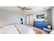 Spacious bedroom featuring a comfortable bed, stylish dresser, and large windows at 19730 E 58Th Pl, Aurora, CO 80019