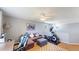 Multi-purpose bonus room with a sofa, desk, exercise equipment and ceiling fan at 19730 E 58Th Pl, Aurora, CO 80019