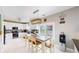 Bright kitchen featuring white cabinets, stainless steel appliances, and a stylish tile backsplash at 19730 E 58Th Pl, Aurora, CO 80019