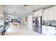 Spacious kitchen seamlessly connected to the dining and living areas with stainless appliances at 19730 E 58Th Pl, Aurora, CO 80019