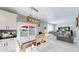 Cozy eat-in kitchen with access to a backyard deck and open to the living room at 19730 E 58Th Pl, Aurora, CO 80019