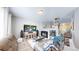 Spacious living room with a fireplace, entertainment center, and comfortable seating at 19730 E 58Th Pl, Aurora, CO 80019