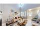 Living room with vaulted ceilings, a fireplace, and a view of the front door at 19730 E 58Th Pl, Aurora, CO 80019