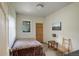 Small bedroom with a bed and a single window and outside access at 13190 Coyote Song Trl, Conifer, CO 80433