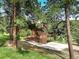 Charming mountain home has a wrap-around deck and drive-under garage, nestled among the trees at 13190 Coyote Song Trl, Conifer, CO 80433