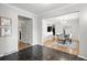 View of the dining room with modern lighting, hardwood floors, and a view of the hall at 6874 S Detroit Cir, Centennial, CO 80122