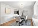 Bright dining room featuring hardwood floors, stylish light fixture, and neutral colors at 6874 S Detroit Cir, Centennial, CO 80122
