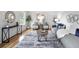 Bright living room showcases stylish furniture, neutral walls, hardwood floors and ample natural light at 6874 S Detroit Cir, Centennial, CO 80122