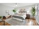 Stylish main bedroom featuring hardwood floors, ceiling fan, modern decor, and natural light at 6874 S Detroit Cir, Centennial, CO 80122