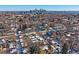 Modern townhome with city skyline view in winter at 3323 W Hayward Pl, Denver, CO 80211