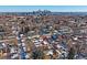 Modern townhome with city skyline view in winter at 3323 W Hayward Pl, Denver, CO 80211