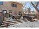 Backyard patio with hot tub and seating at 3323 W Hayward Pl, Denver, CO 80211