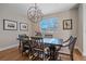 Bright dining room with hardwood floors and chandelier at 3323 W Hayward Pl, Denver, CO 80211