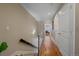 Upstairs hallway with hardwood floors and modern light fixture at 3323 W Hayward Pl, Denver, CO 80211