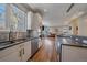 Modern kitchen with stainless steel appliances and open layout at 3323 W Hayward Pl, Denver, CO 80211