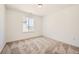 Simple bedroom with a single window and neutral carpeting at 4599 Windmill Dr, Brighton, CO 80601