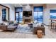 Relaxing resident clubhouse lounge area, featuring comfortable sofas, large screen TV and fireplace at 4599 Windmill Dr, Brighton, CO 80601