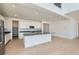 Modern open-concept kitchen featuring an island, stainless steel appliances, and ample cabinet space at 4599 Windmill Dr, Brighton, CO 80601