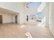 Expansive living room offering natural light, tall ceilings, and sliding door access to the patio at 4599 Windmill Dr, Brighton, CO 80601