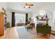 Inviting living room featuring a fireplace, large bay window, and hardwood floors at 1536 Newport St, Denver, CO 80220