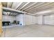 Unfinished basement with open layout, concrete floors, and white-wrapped walls at 4992 Trails Edge Ln, Castle Rock, CO 80104