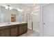 Clean bathroom featuring double sinks, granite countertop, and a glass-enclosed shower at 4992 Trails Edge Ln, Castle Rock, CO 80104