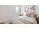 Bright bedroom with neutral decor, plush bedding, and an eye-catching art display above the bed at 4992 Trails Edge Ln, Castle Rock, CO 80104